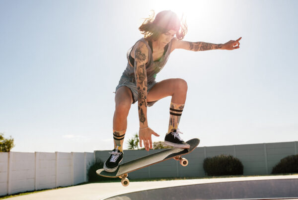 K2 Kinetic women skater doing ollie on skateboard