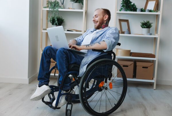 Laughing man on a laptop