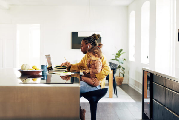 Lady with child working from home