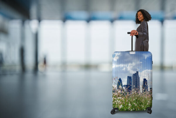 K2 branded image of lady with suitcase and the London skyline