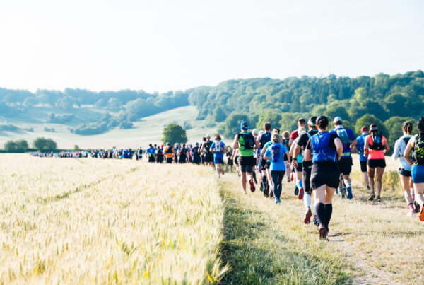 Group of people walking through a field