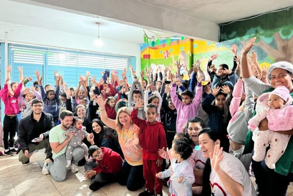 Children in Brazil school waving and smiling