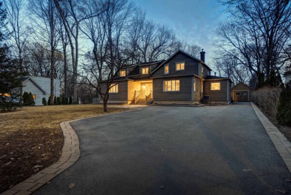 Real estate photography - exterior of single family house during twilight hours in Montreal's suburb