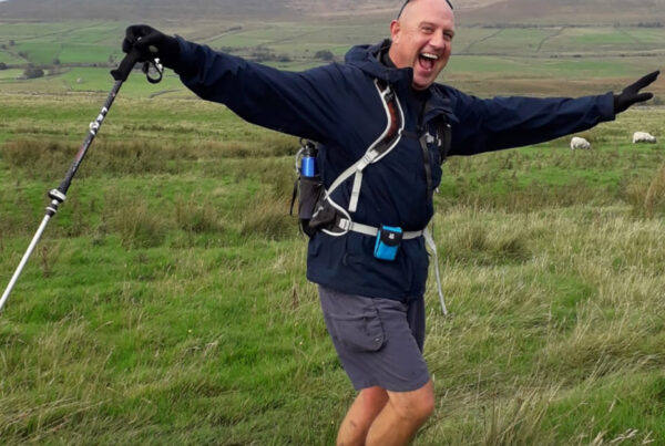 Richard Rutledge in a field walking