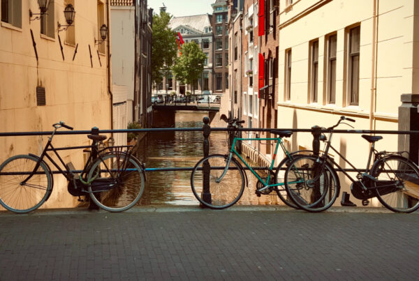 Bicycles locked to the railings of a bridge