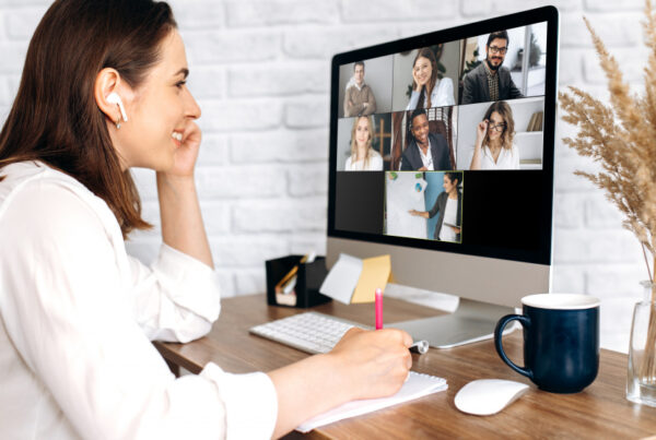 Lady with headphones on video conference call