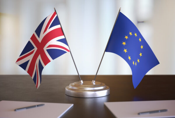 UK and EU flags on a desk