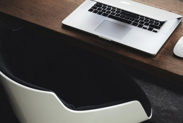 Chair with a desk and laptop