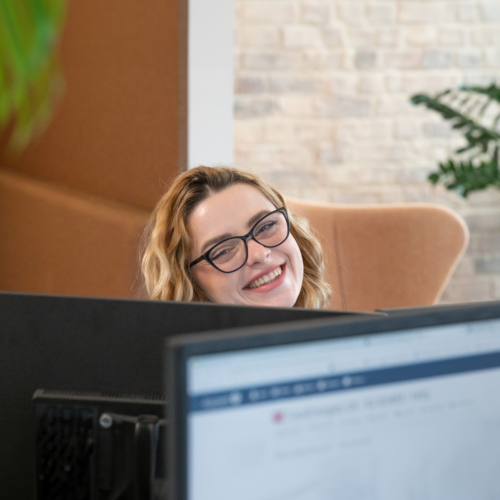 K2 Iryna Zahorivska smiling at a computer