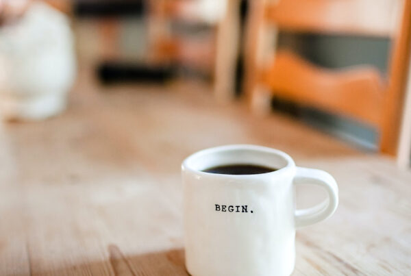 Coffee cup with the word begin written on it