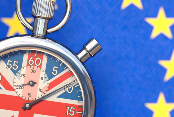 Stop watch with UK flag on face and EU flag behind
